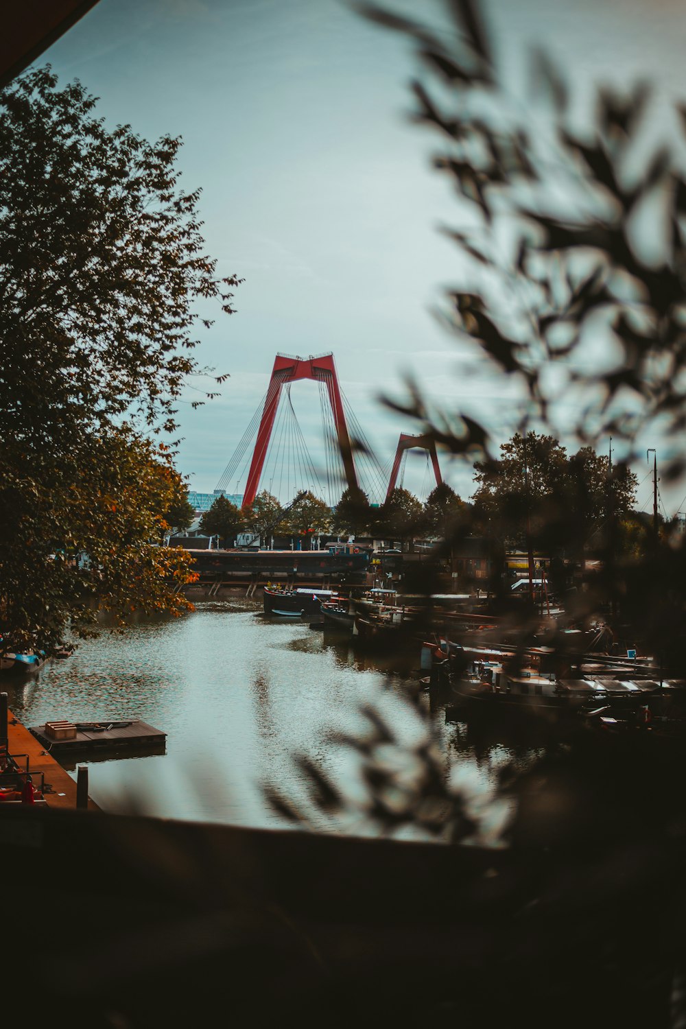 a red bridge over a body of water