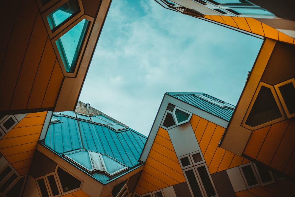 looking up at a building with a sky in the background