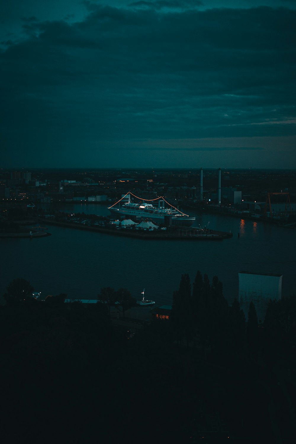 a view of a city at night from a hill