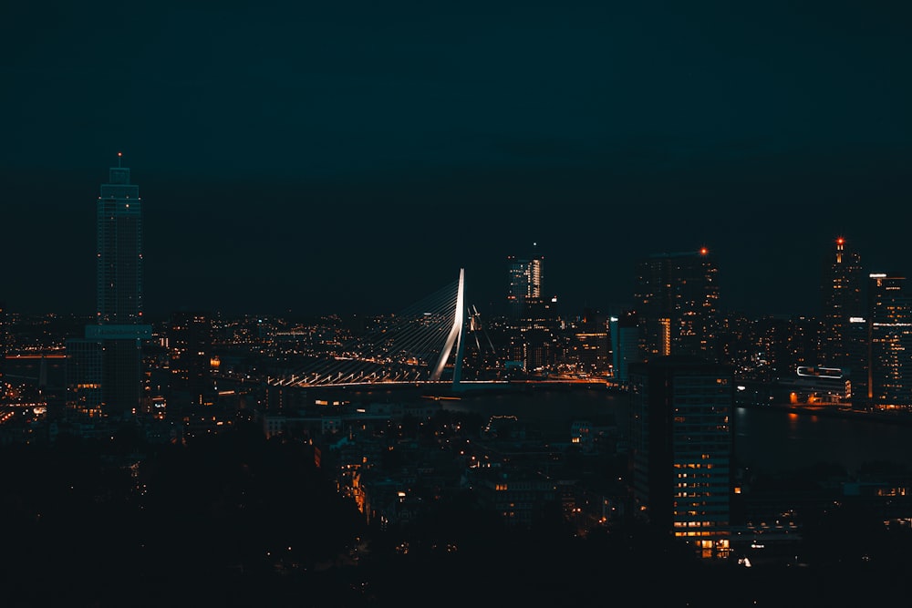 a view of a city at night from a hill