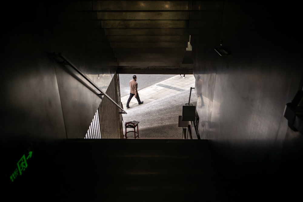 a man walking down a flight of stairs