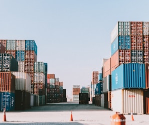 a large amount of containers are stacked on top of each other