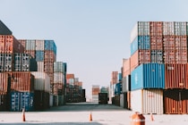 a large amount of containers are stacked on top of each other