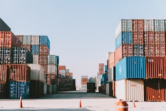 a large amount of containers are stacked on top of each other