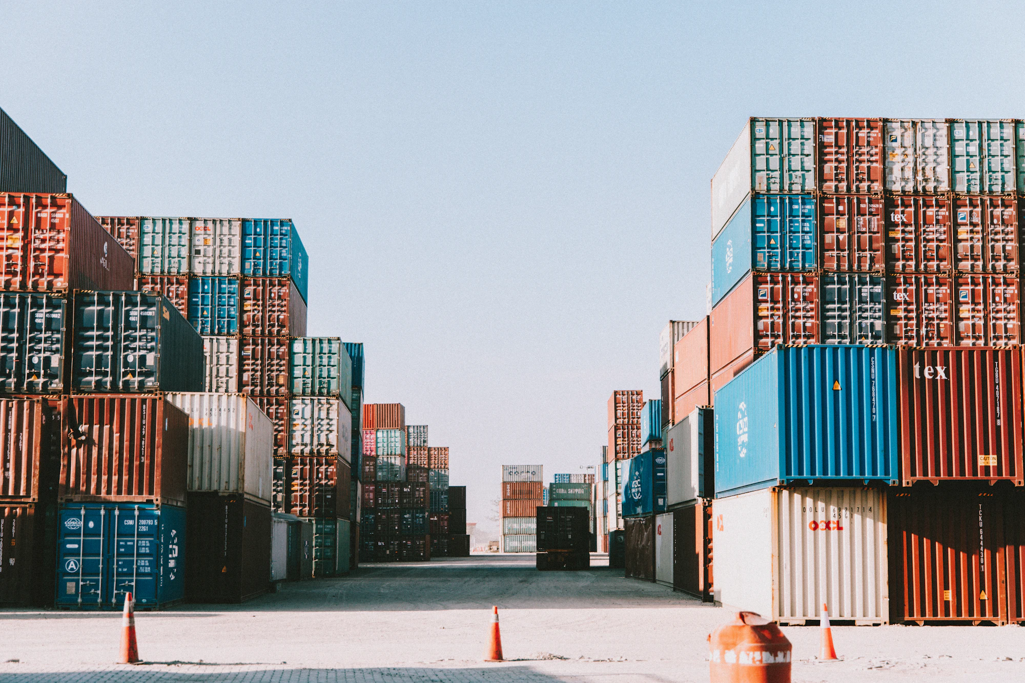 Cargo containers at a port at dusk