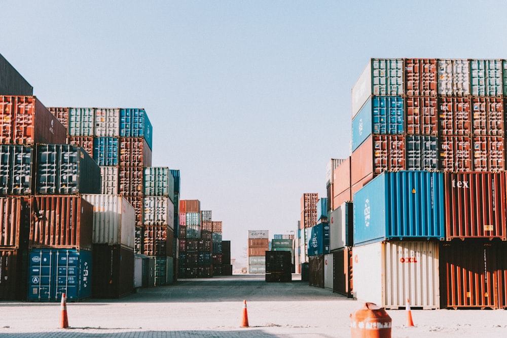 a large amount of containers are stacked on top of each other