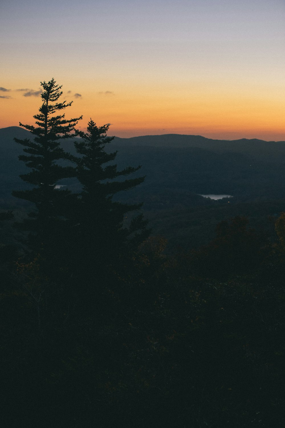 a view of a sunset from a mountain top