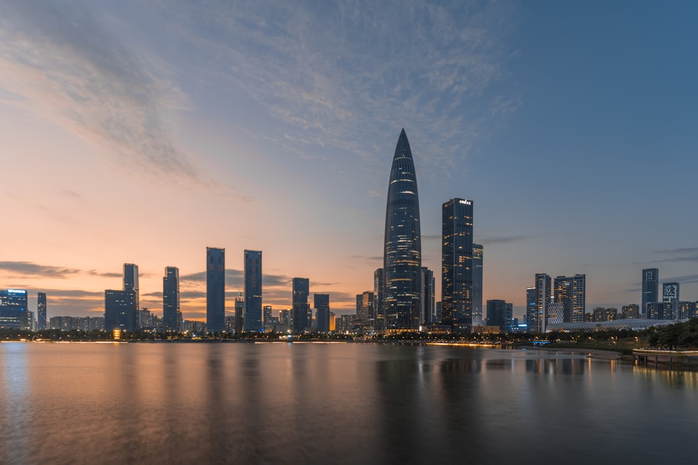 a large body of water with a city in the background