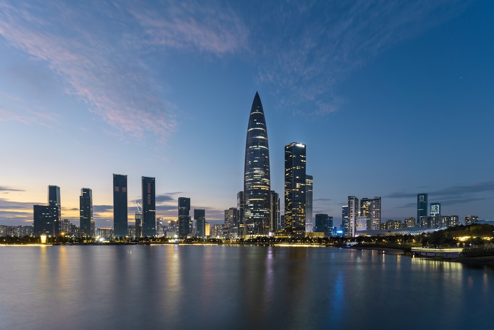 a large body of water with a city in the background