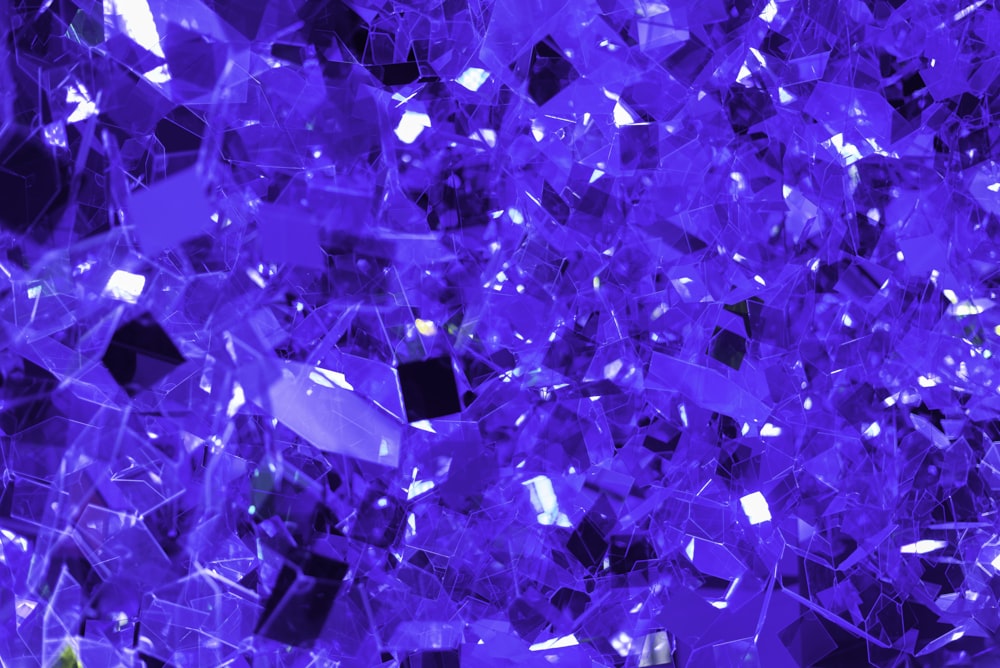 a large pile of purple glass shards