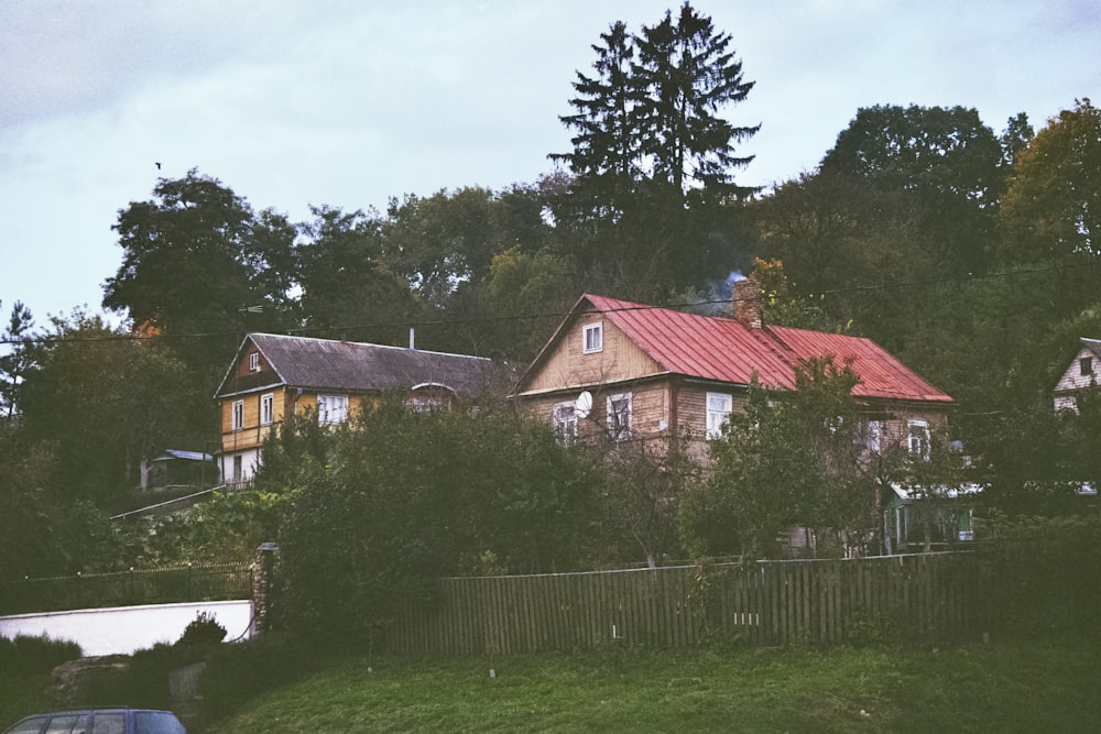 a house on a hill with a red roof