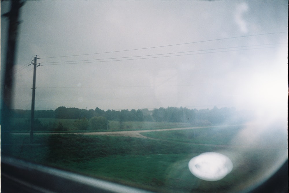 a view of a road through a car window