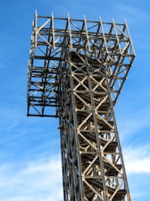 a tall metal structure with a sky background