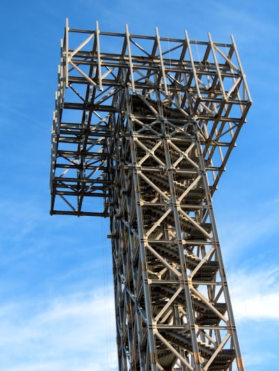 a tall metal structure with a sky background