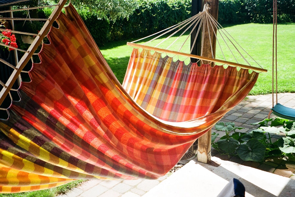 a hammock hanging from a wooden pole