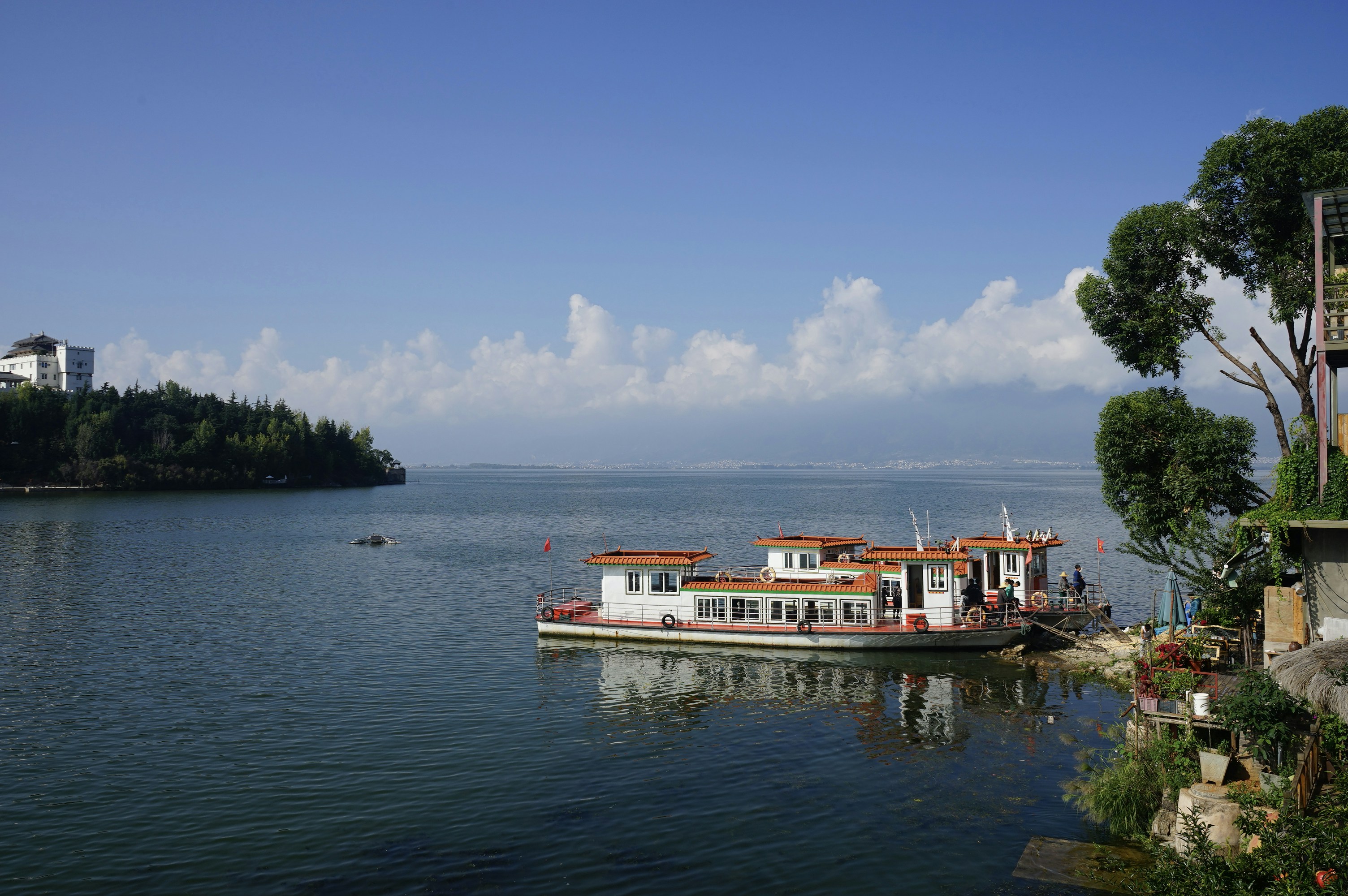 a large boat floating on top of a large body of water