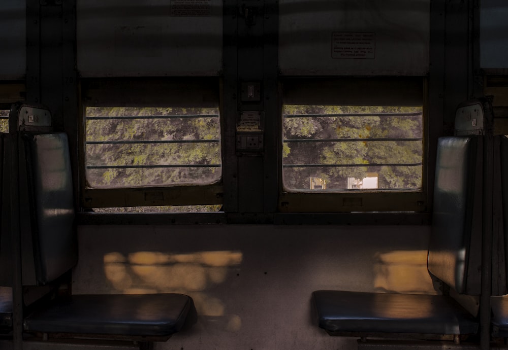 the inside of a train car with two seats