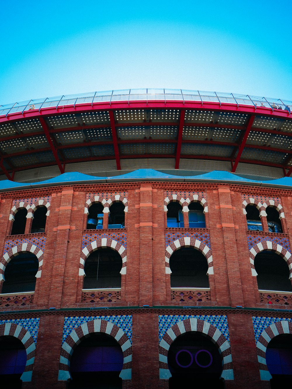 a red brick building with a blue sky in the background