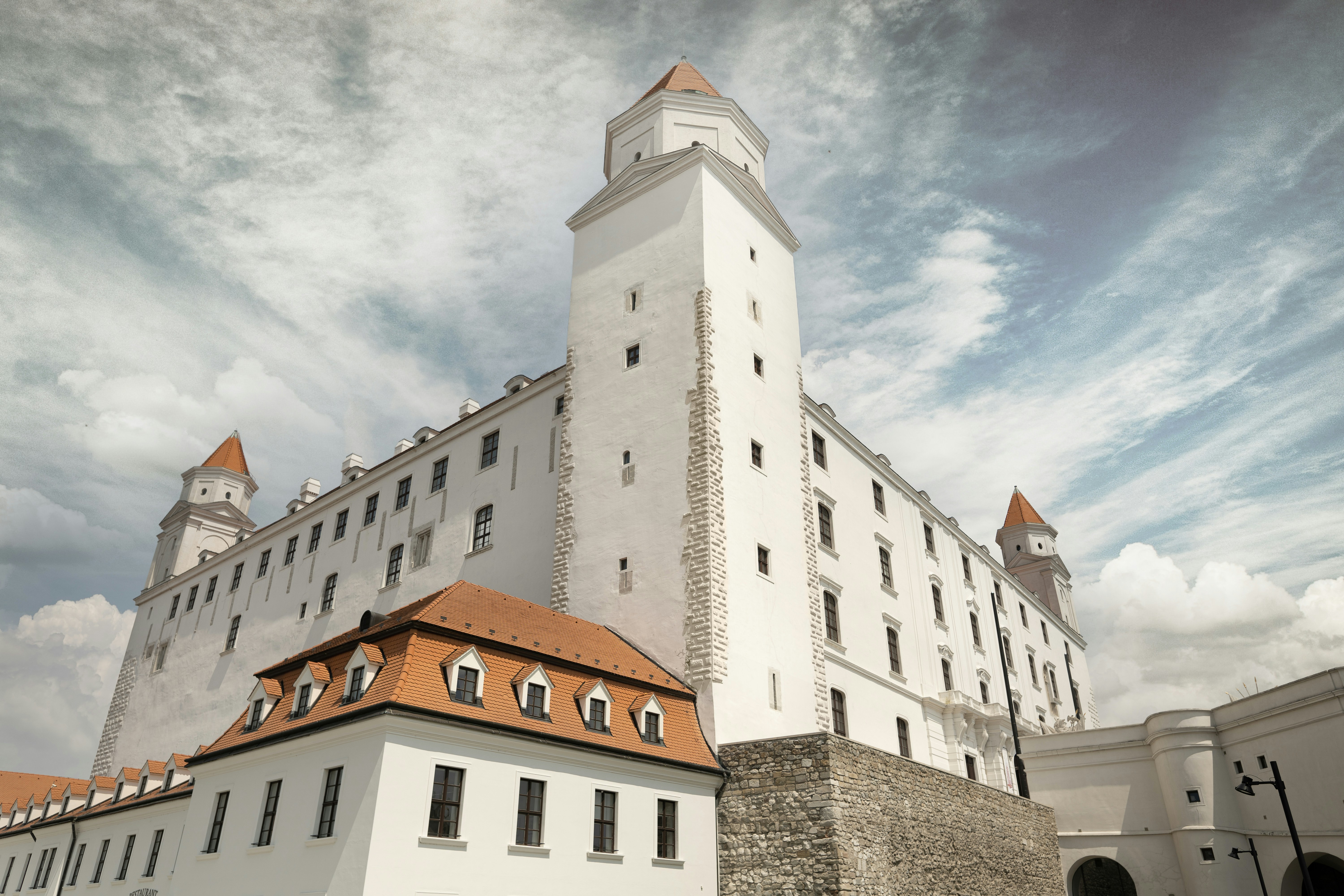 a large white building with a red roof