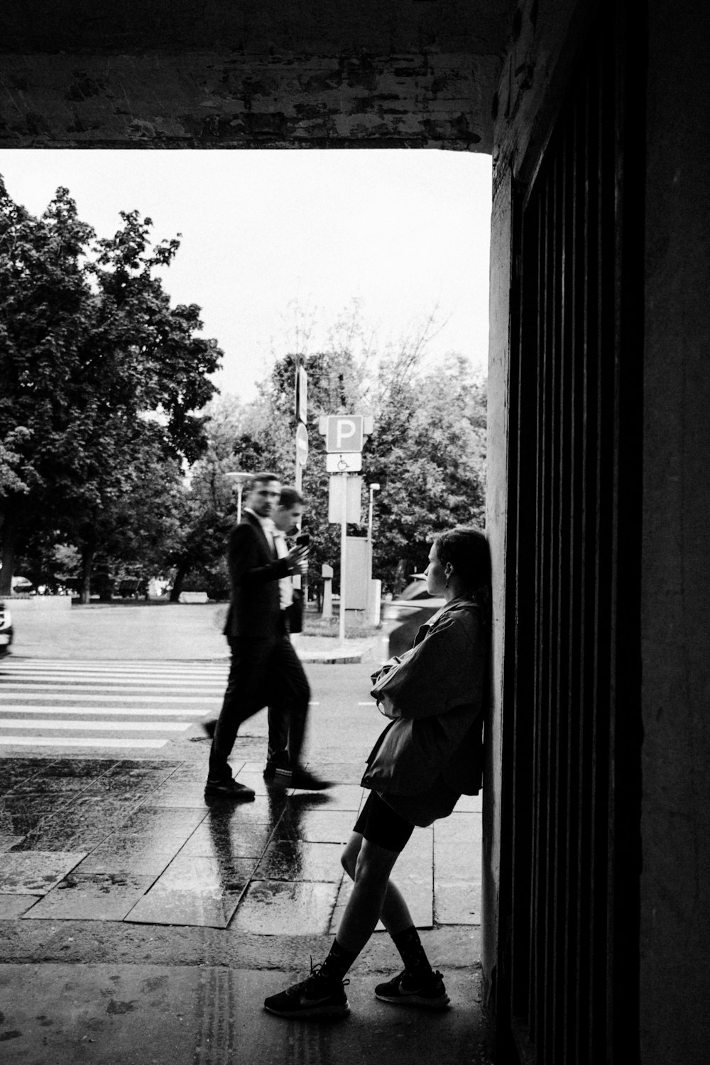 a man and a woman walking down a sidewalk