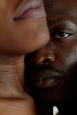 a close up of a man's face and neck