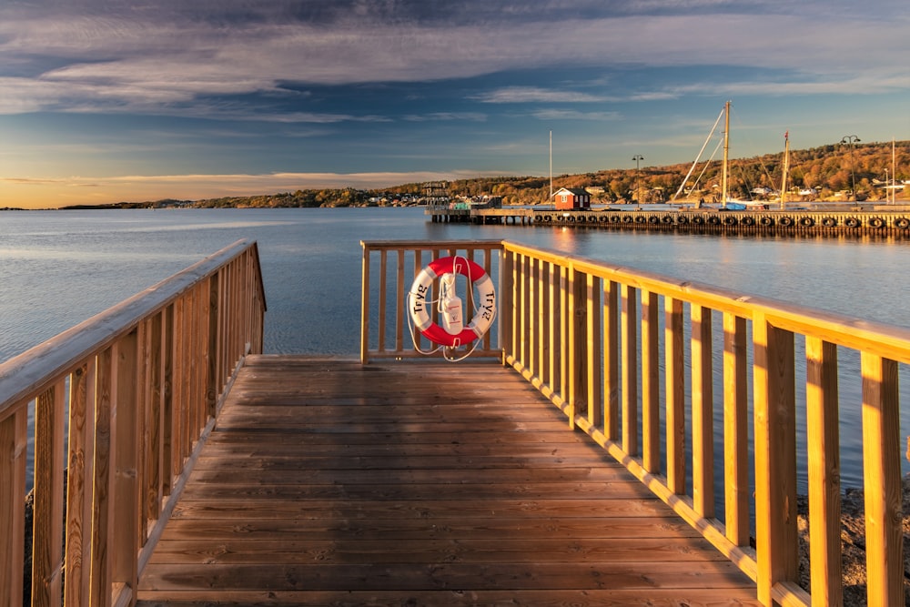 a wooden dock with a life preserver on it