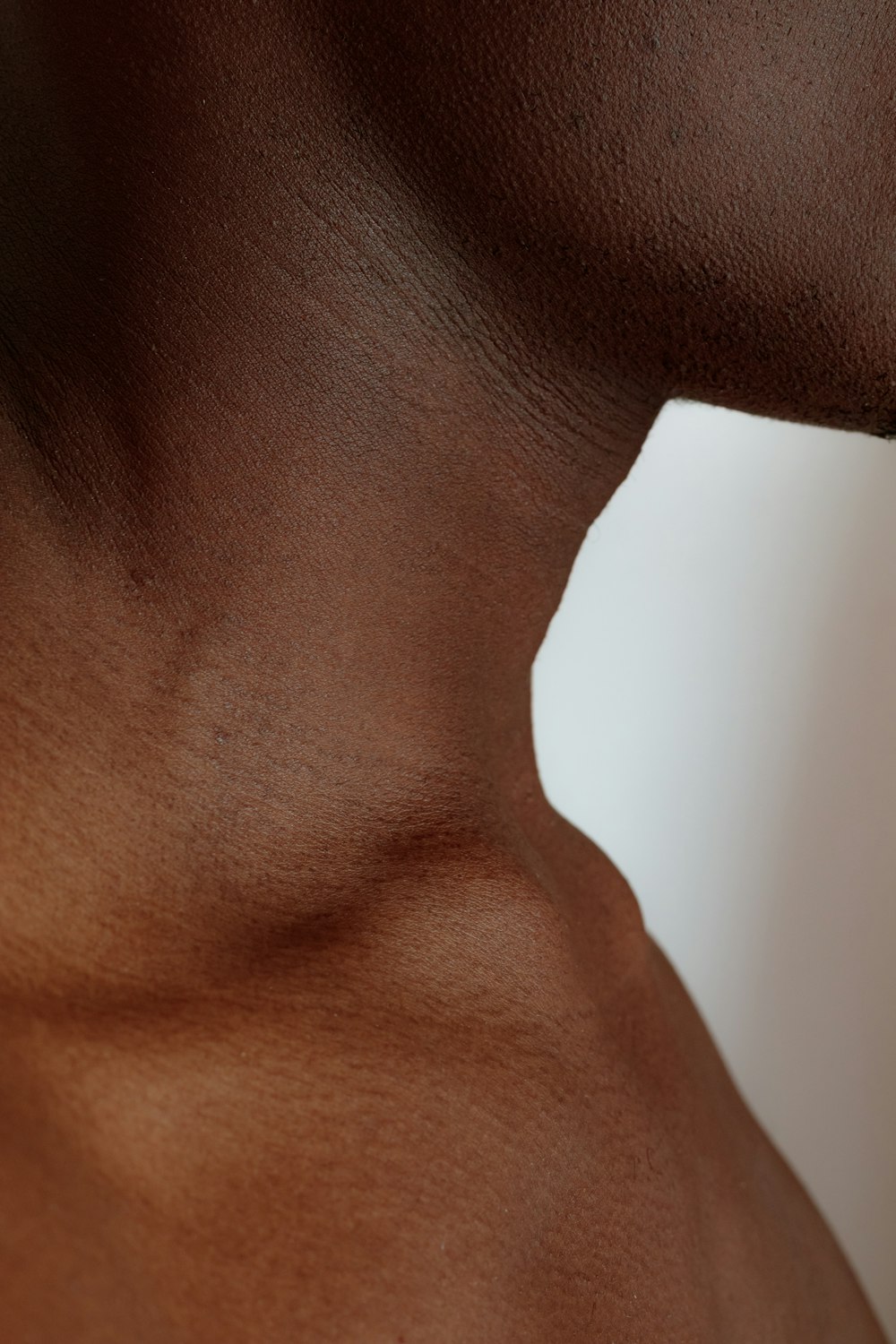 a close up of a man's back with no shirt on