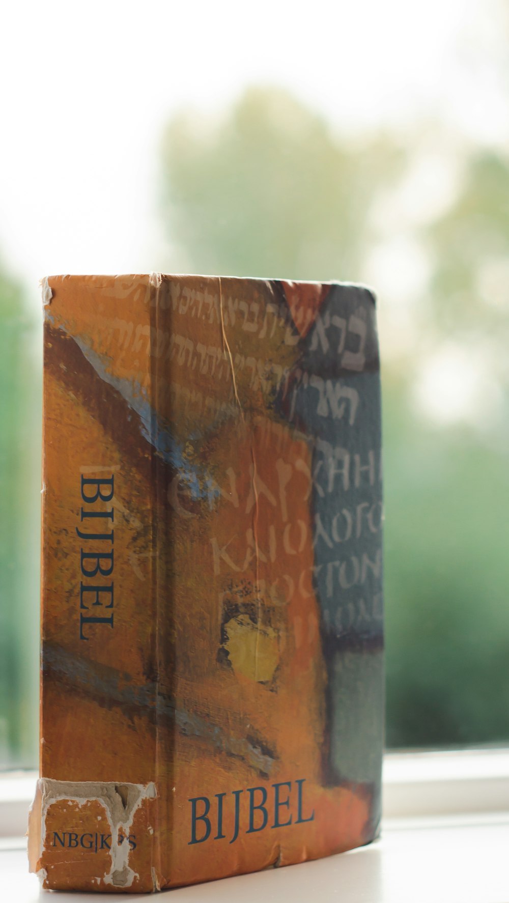 a close up of a book on a window sill