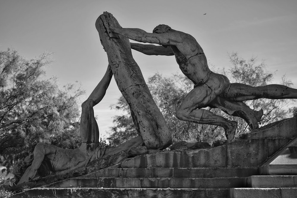 a black and white photo of a statue