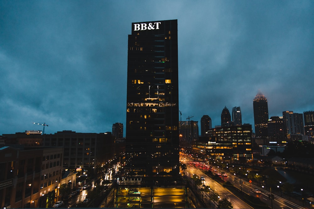 a tall building with a sign on top of it