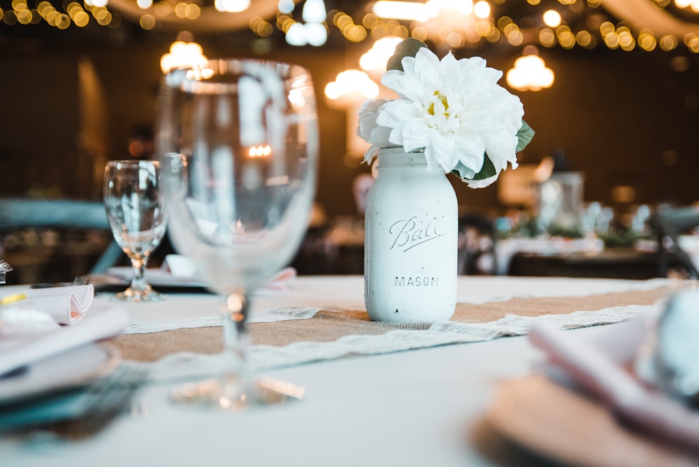 a table with a vase of flowers on top of it