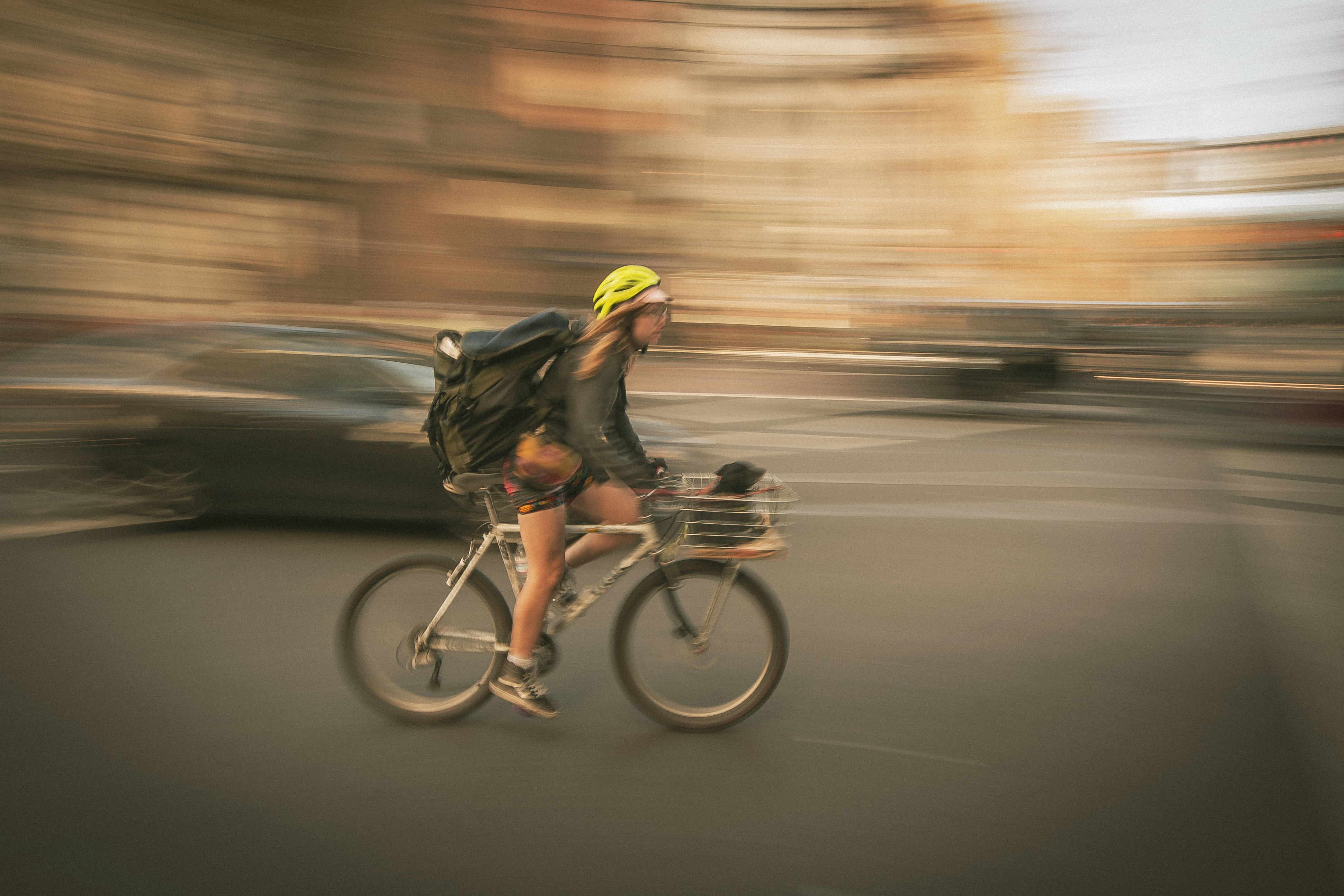 a person riding a bike down a street
