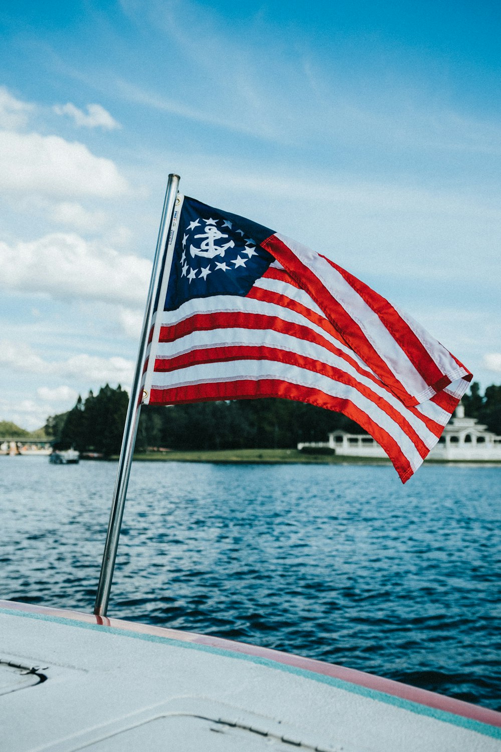 an american flag on a boat in the water