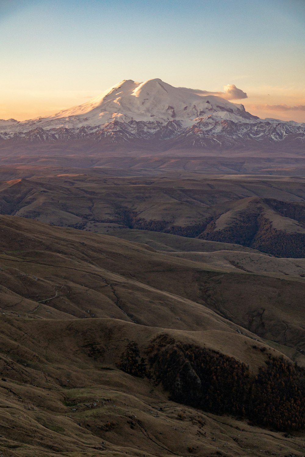 a view of a snow covered mountain in the distance