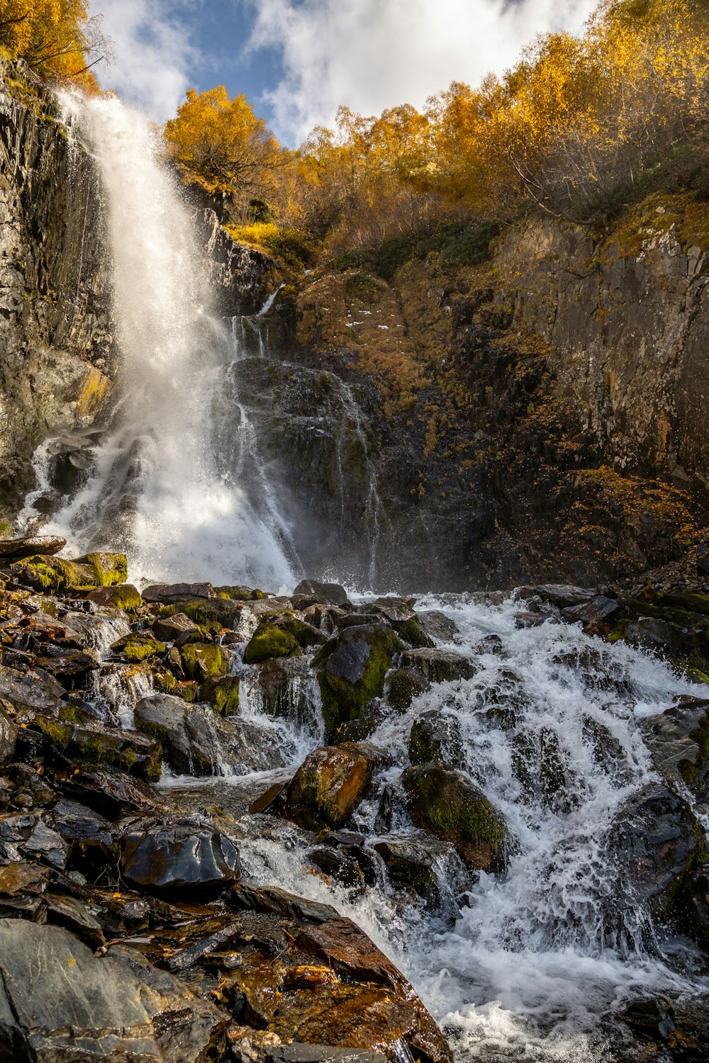 a large waterfall with lots of water coming out of it