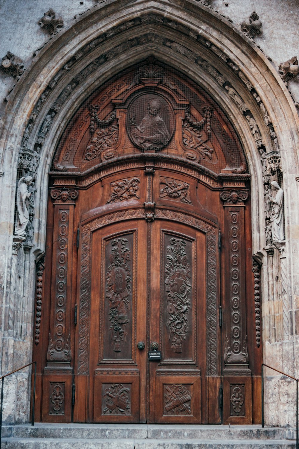 a large wooden door with carvings on it