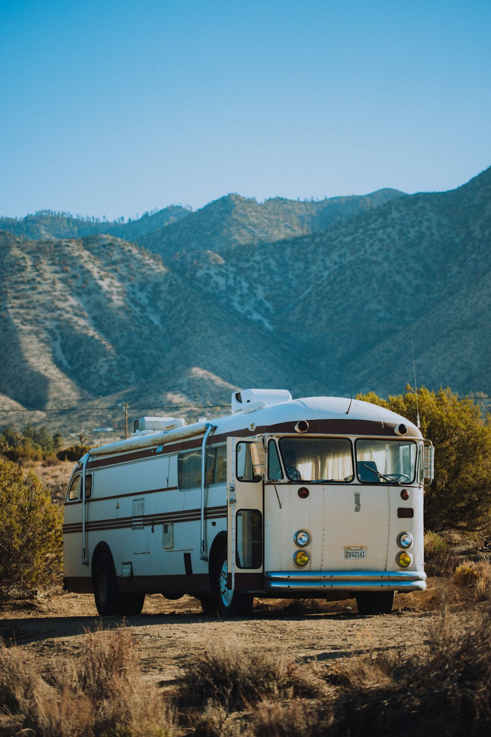 a bus parked in the middle of the desert