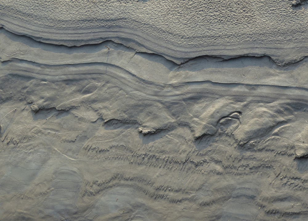 a sandy beach covered in lots of sand