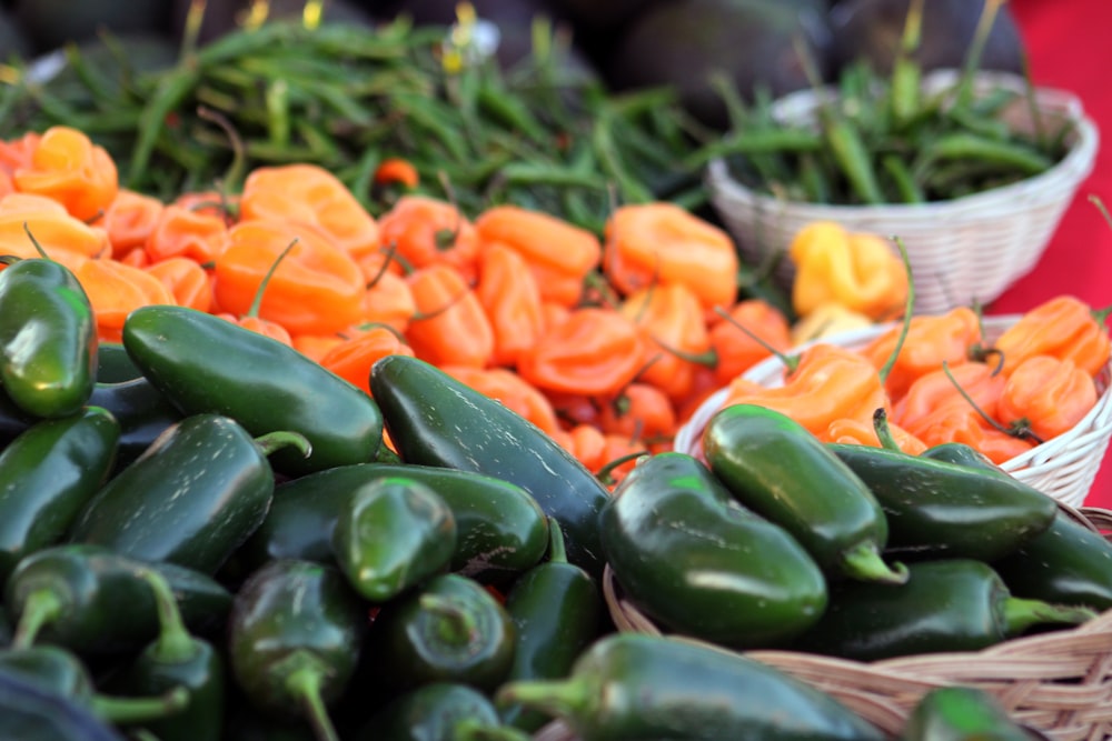 a variety of vegetables are on display in baskets