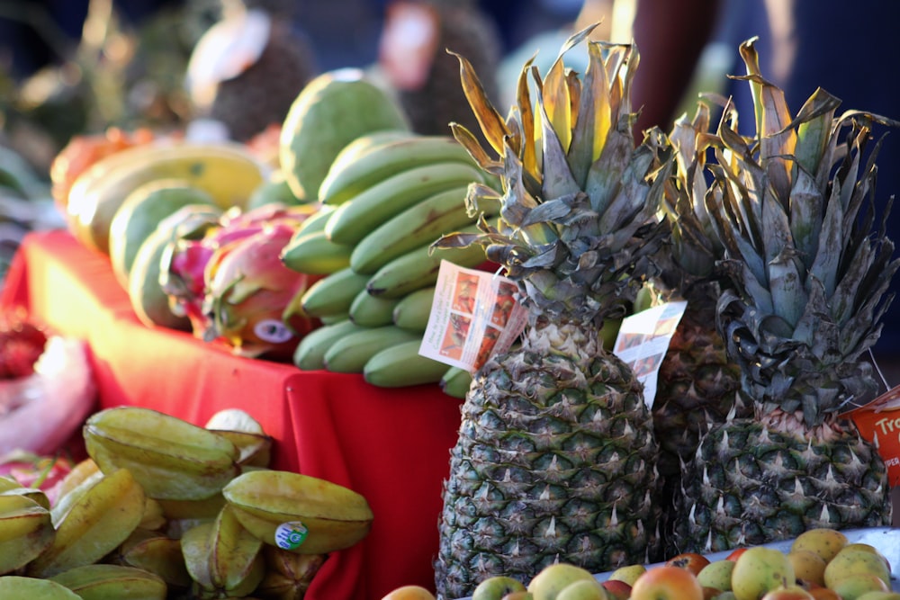 a table topped with lots of different types of fruit