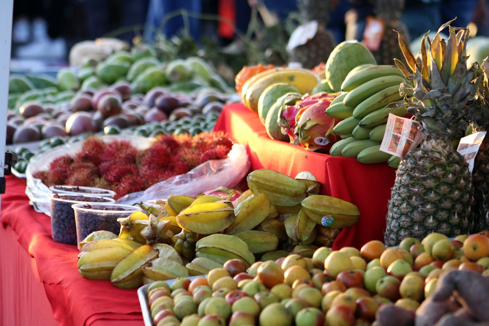 a table filled with lots of different types of fruit