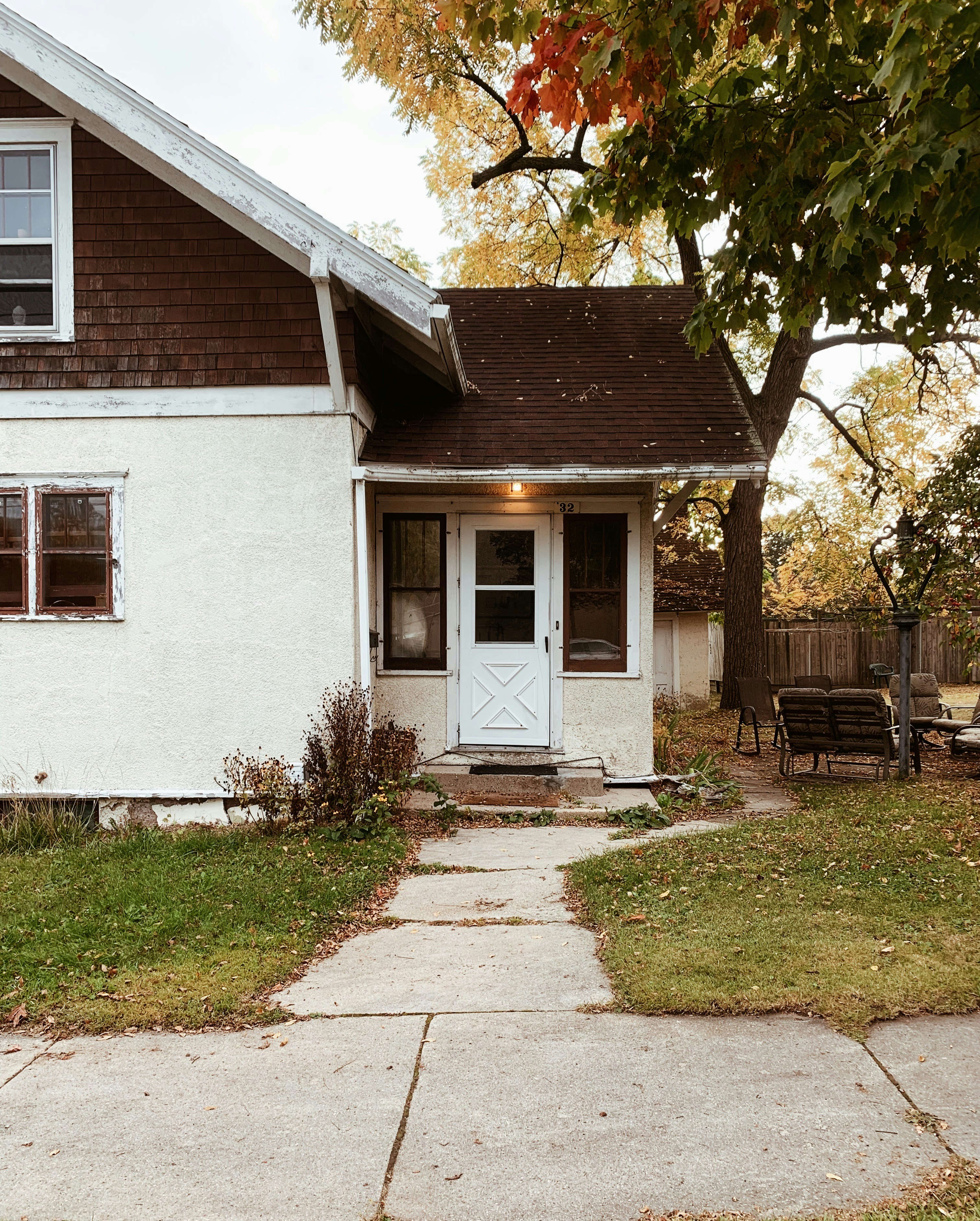 a small white house with a white door