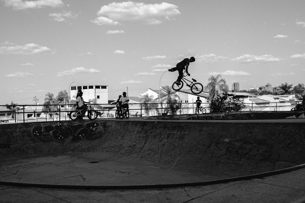 a man riding a skateboard up the side of a ramp