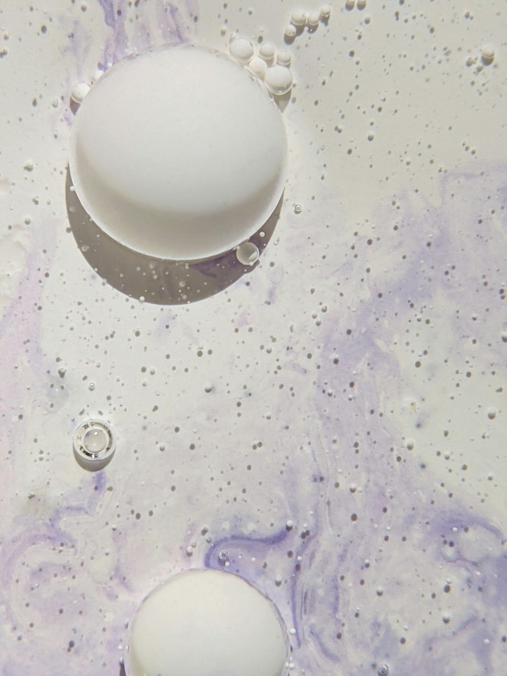 a close up of two eggs in a sink