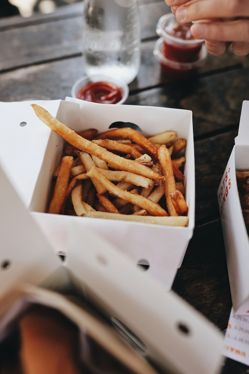 a box of french fries sitting on top of a table