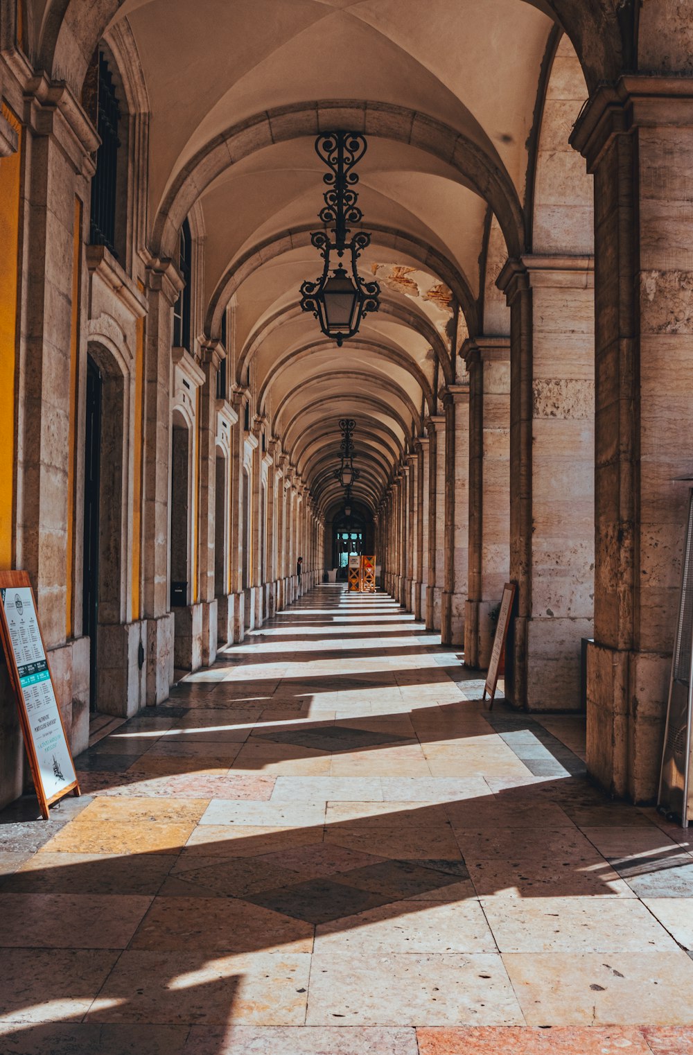 a long hallway with a light hanging from the ceiling