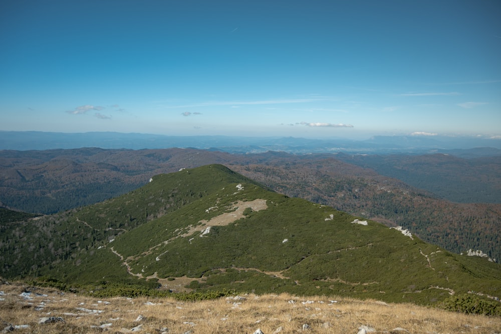 a view of the mountains from the top of a hill