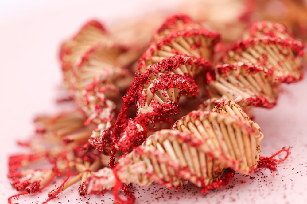 a close up of a bunch of red sprinkles
