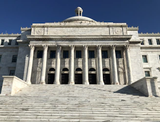 a large building with columns and a dome on top