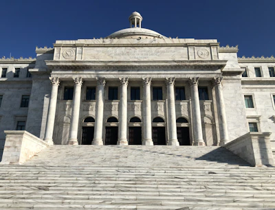 a large building with columns and a dome on top